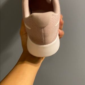 Blush pink Nike running shoes